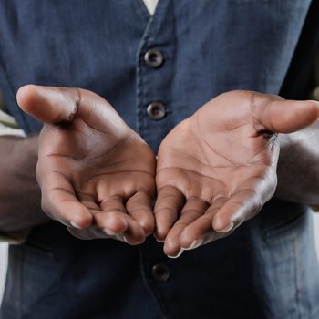 African-American holds open palm