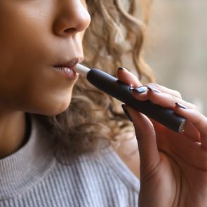 close up of young woman Vaping