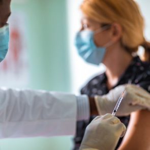 Young woman getting vaccinated