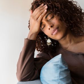 Woman With Headache Holding Her Head