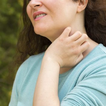 woman suffering itching scratching neck