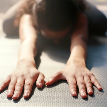 hands stretching while doing yoga